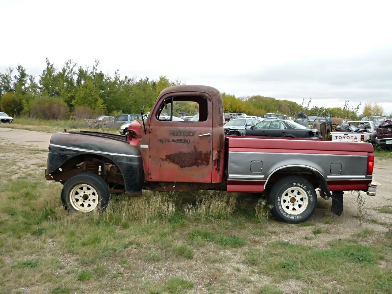 Hybrid old truck in a salvage yard, 2009
